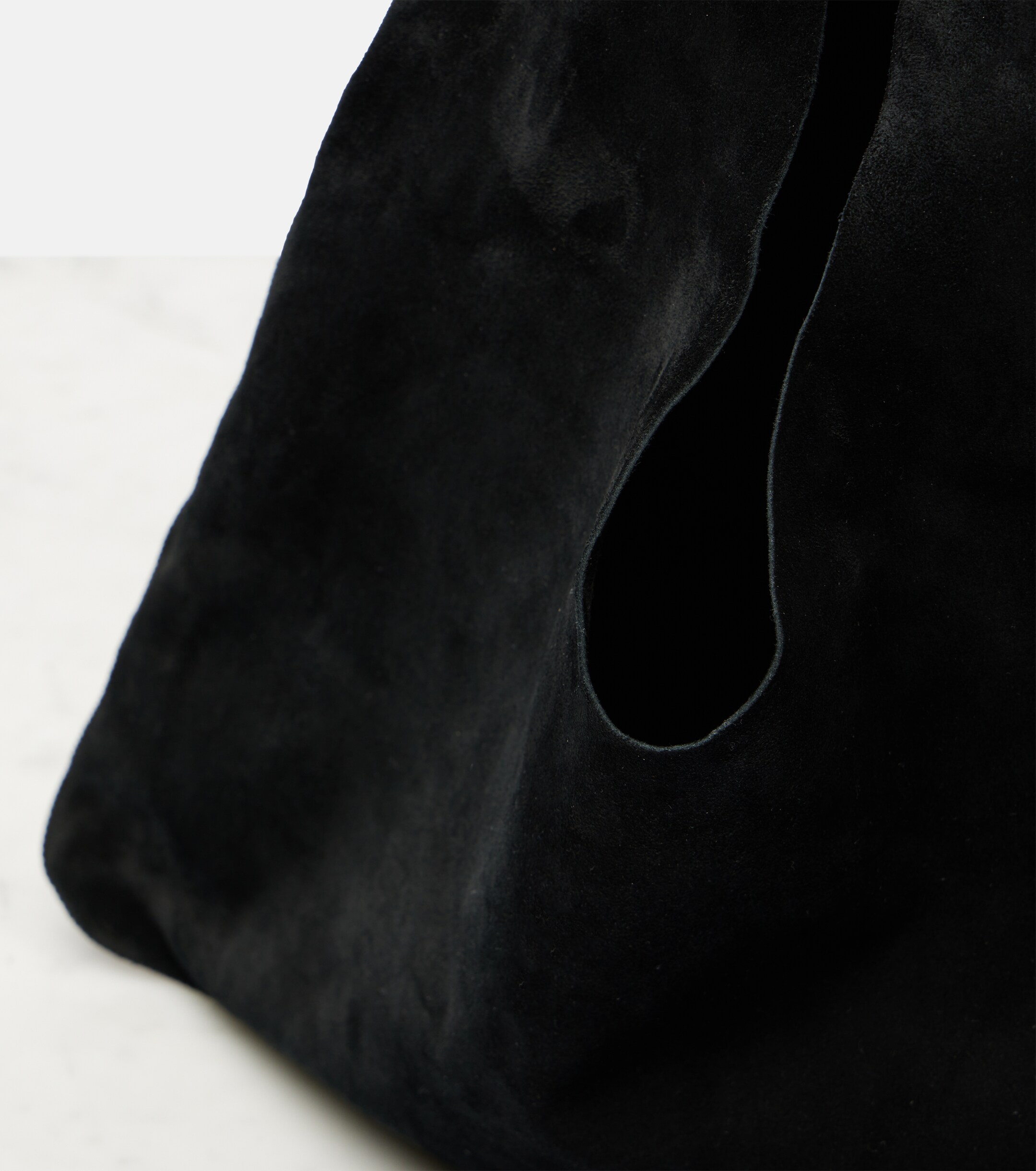 The Row Bindle Small suede top-handle bag