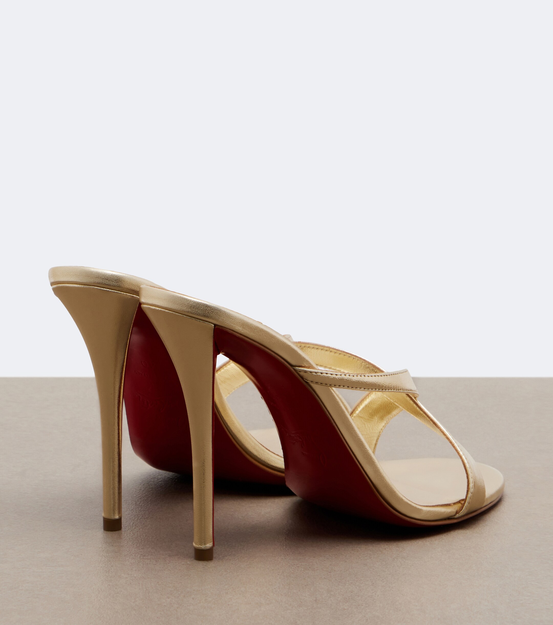 CHRISTIAN LOUBOUTIN Christian Louboutin Mulazee Cross metallic leather sandals