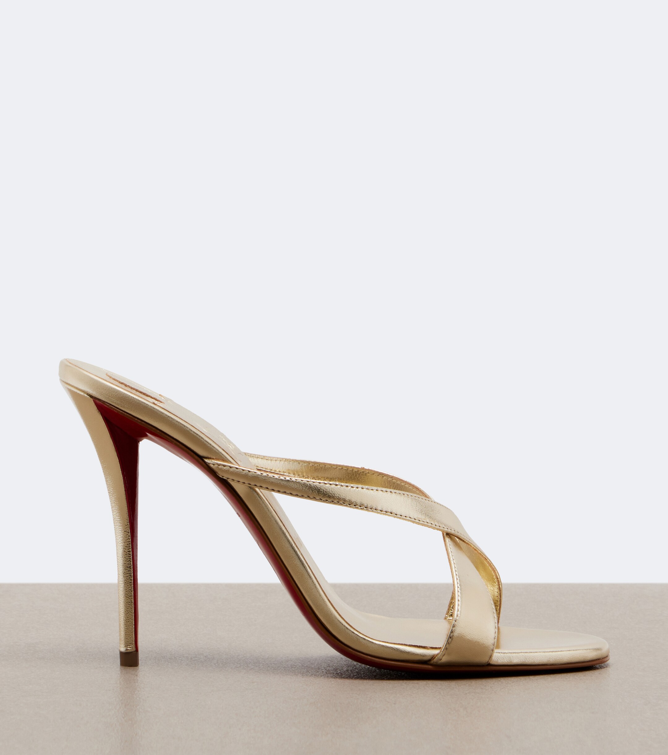 CHRISTIAN LOUBOUTIN Christian Louboutin Mulazee Cross metallic leather sandals