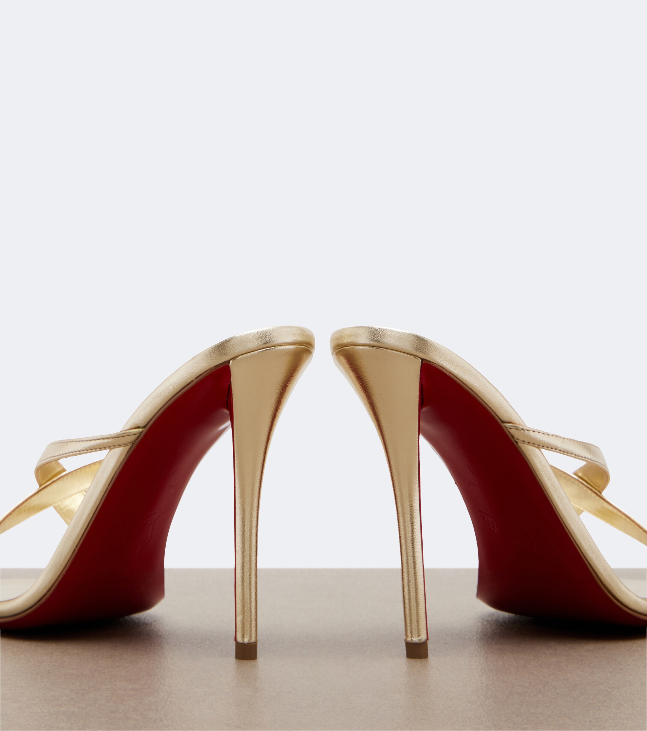 CHRISTIAN LOUBOUTIN Christian Louboutin Mulazee Cross metallic leather sandals