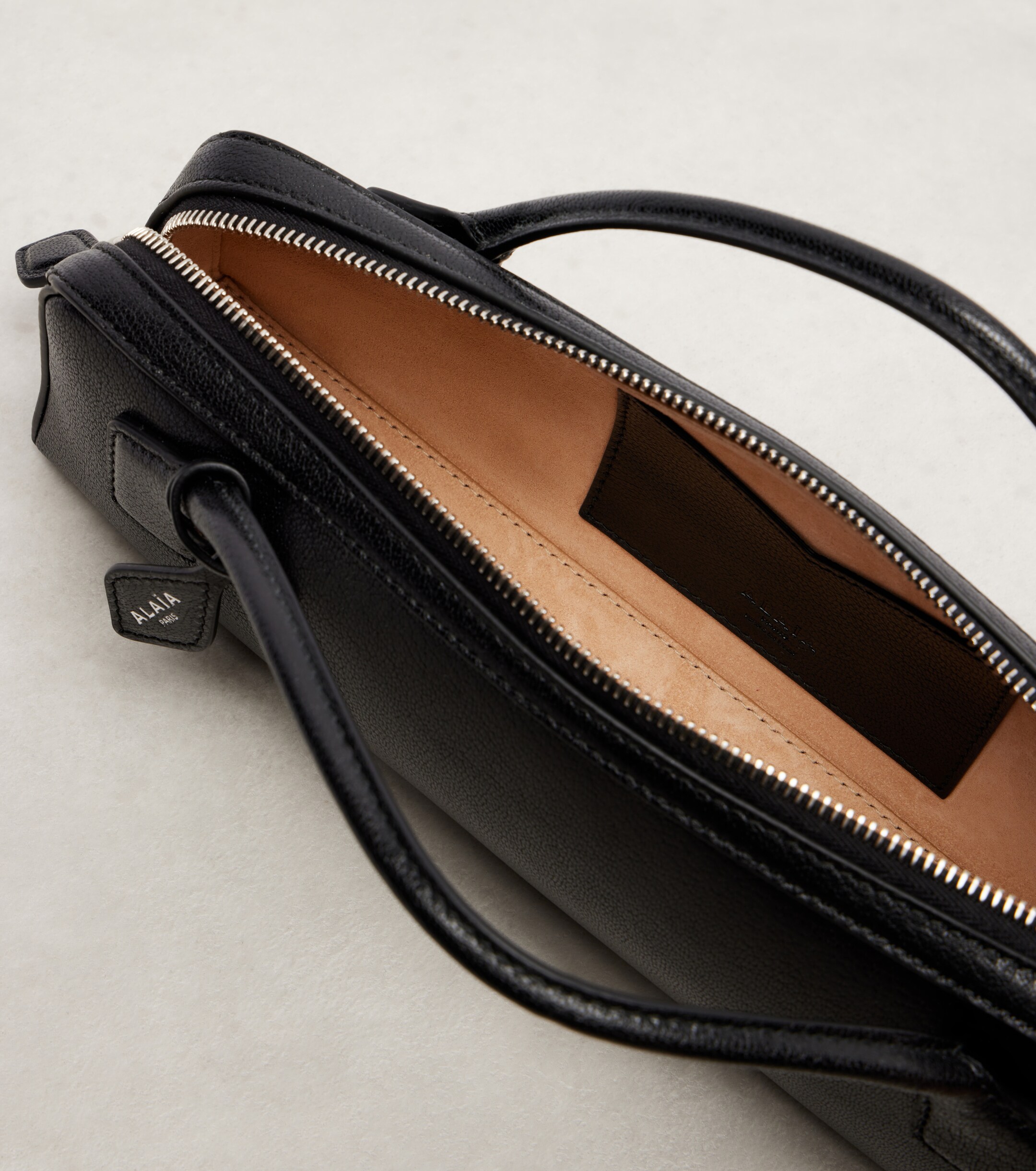 Alaïa Le Teckel Small leather clutch