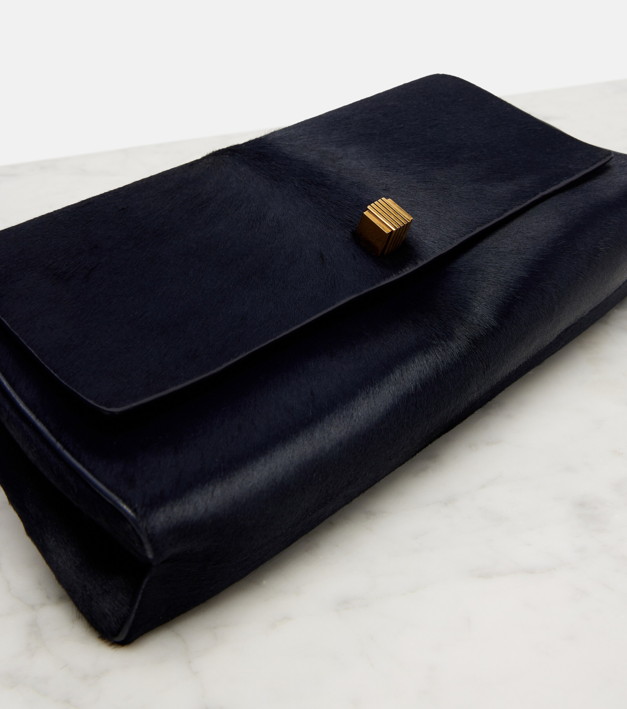 KHAITE Audrey calf hair clutch