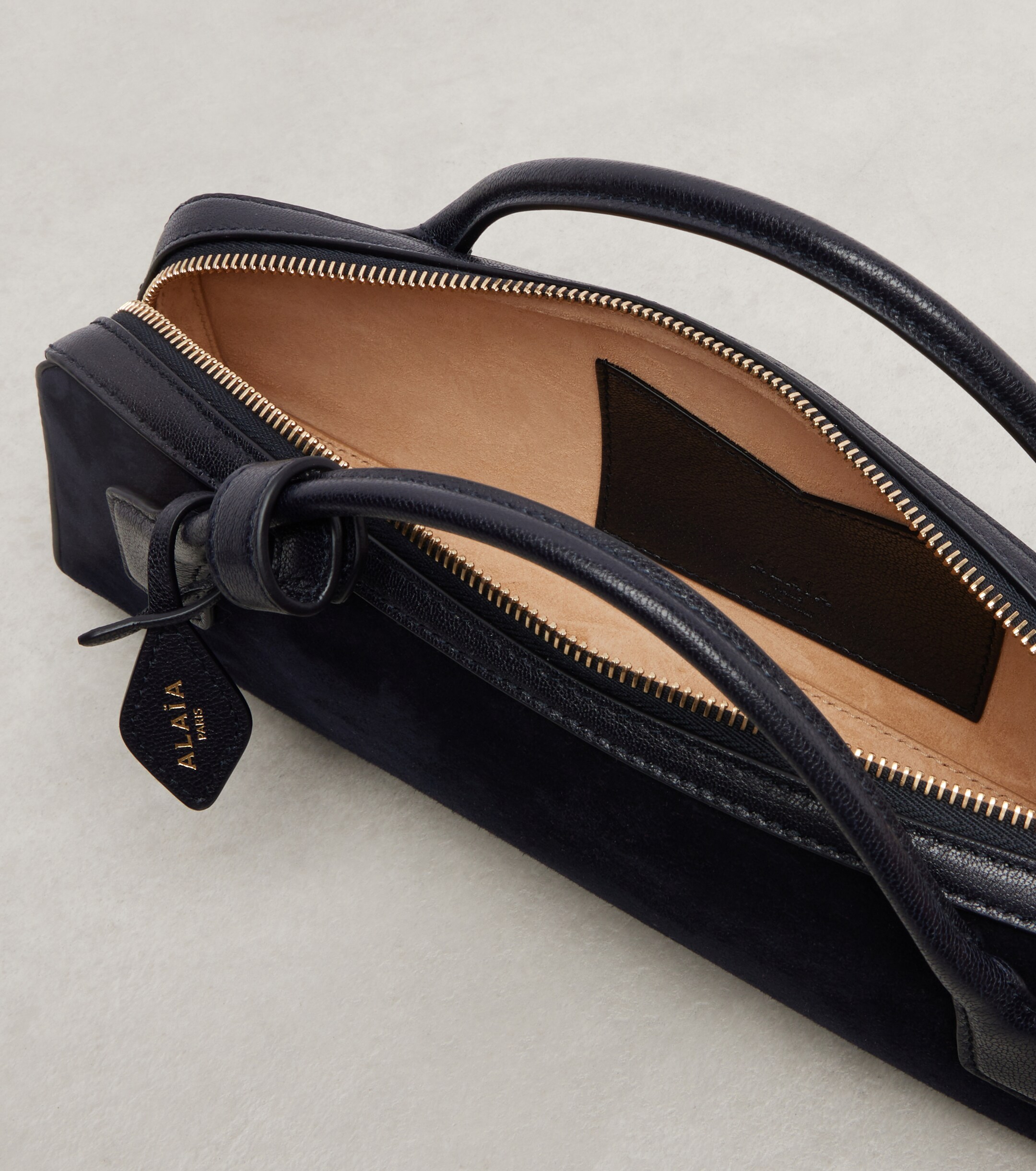 Alaïa Le Teckel Small suede clutch