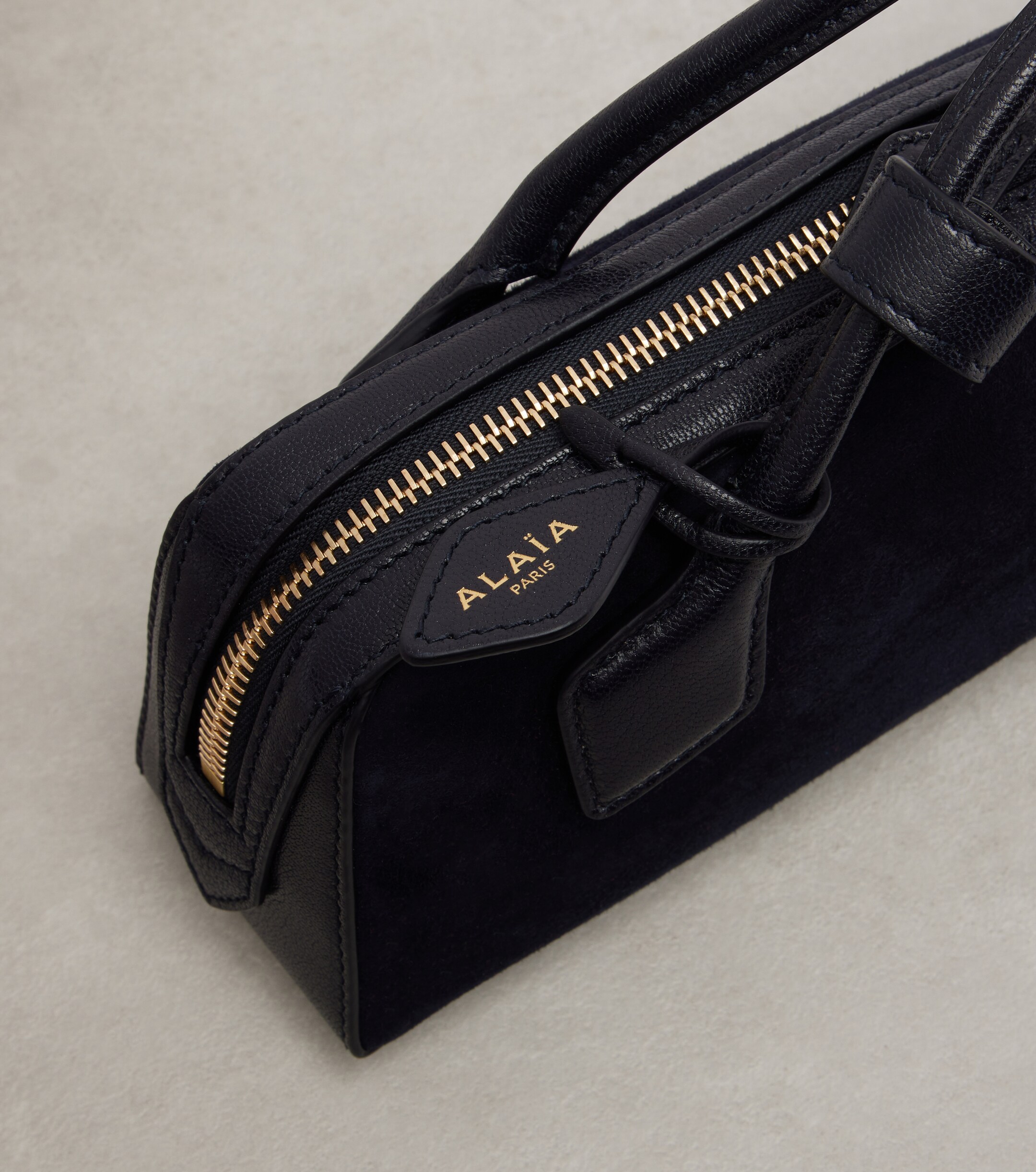 Alaïa Le Teckel Small suede clutch