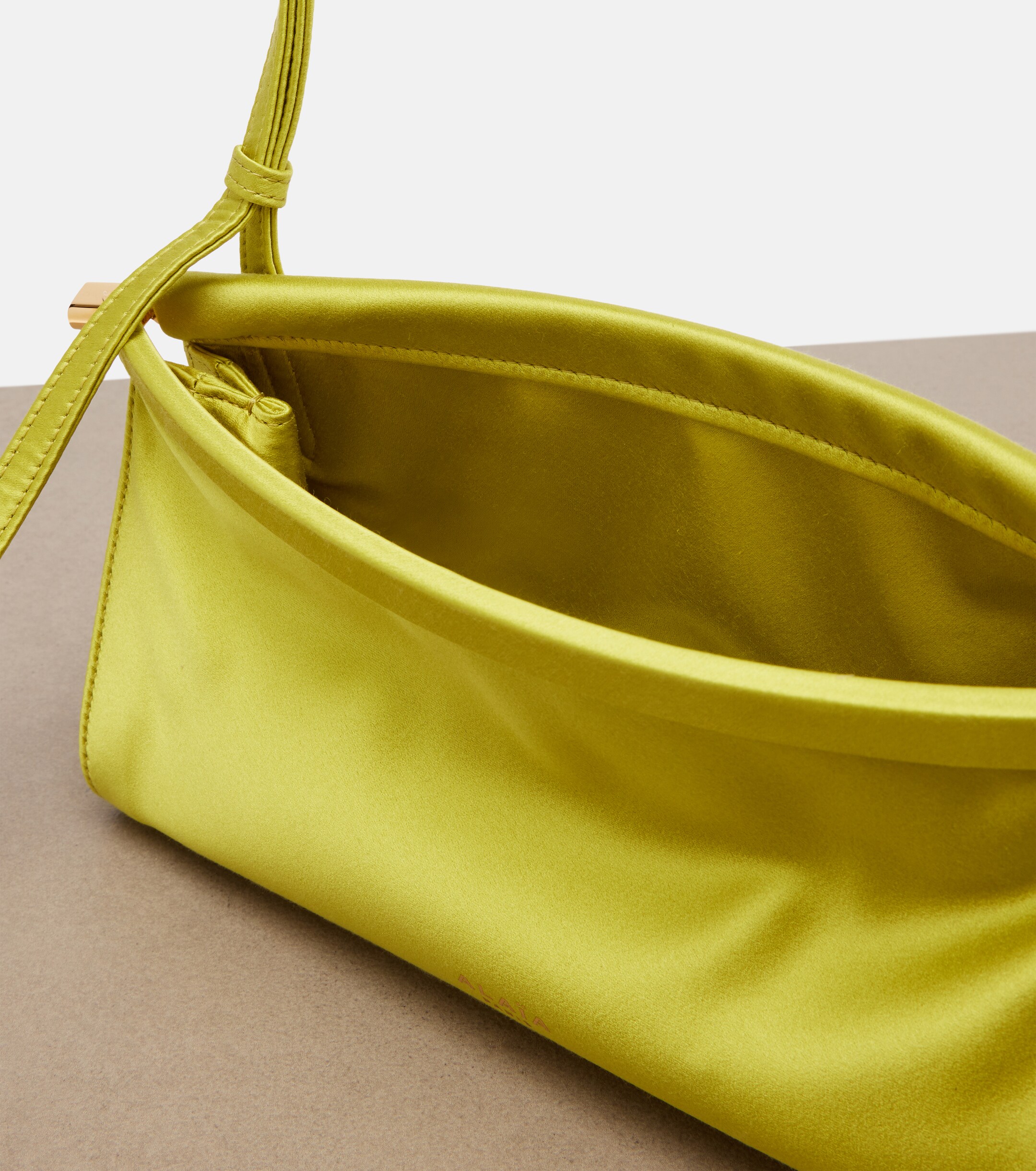 Alaïa Le Click East West Small leather-trimmed satin shoulder bag