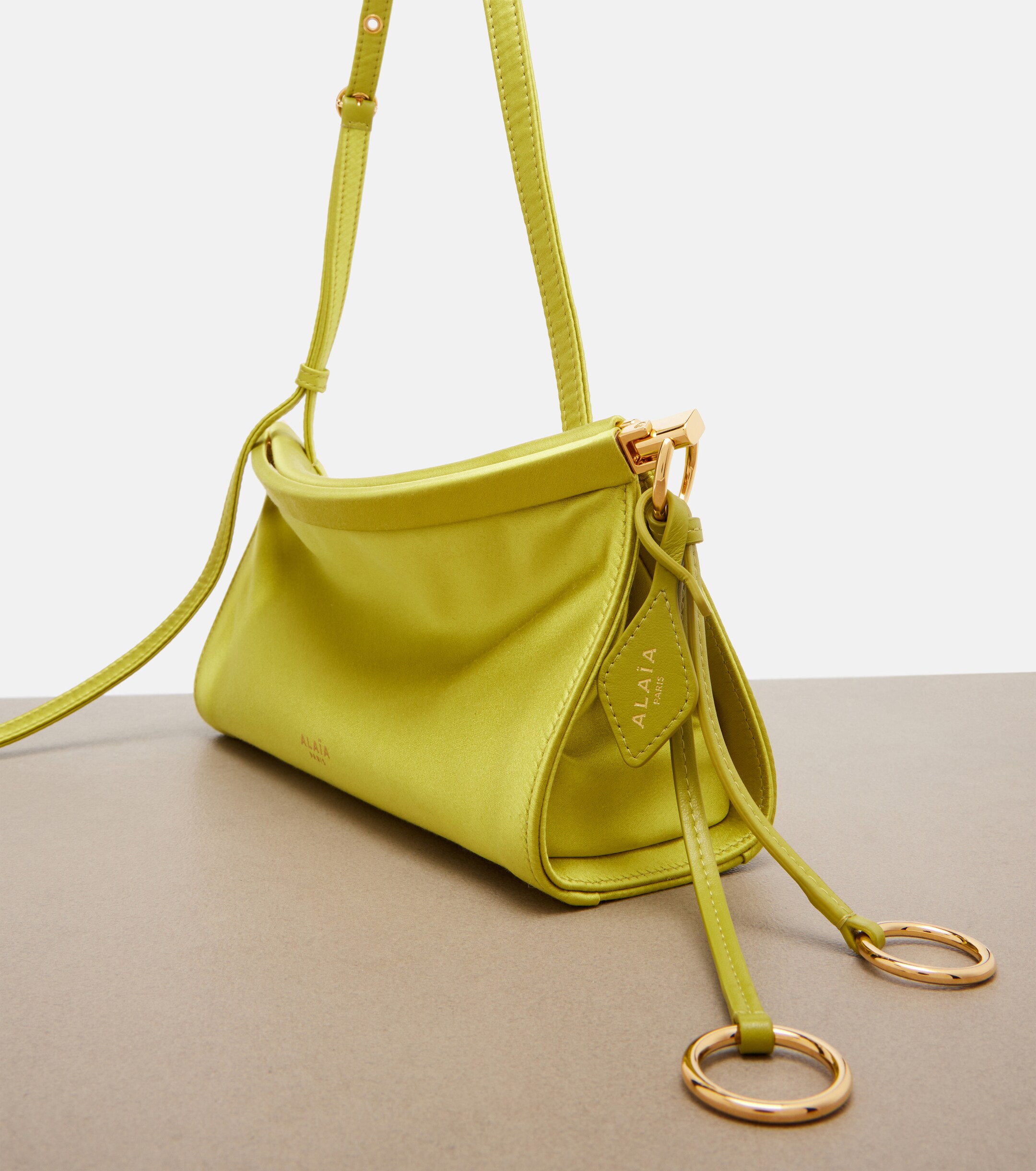 Alaïa Le Click East West Small leather-trimmed satin shoulder bag