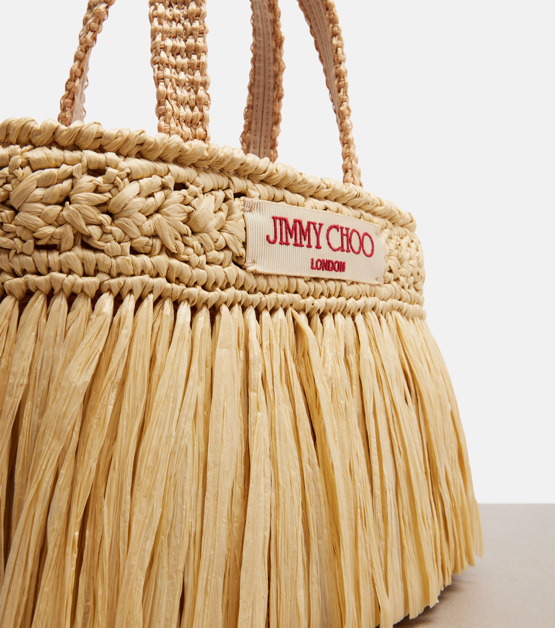 JIMMY CHOO Mini fringed raffia top-handle bag