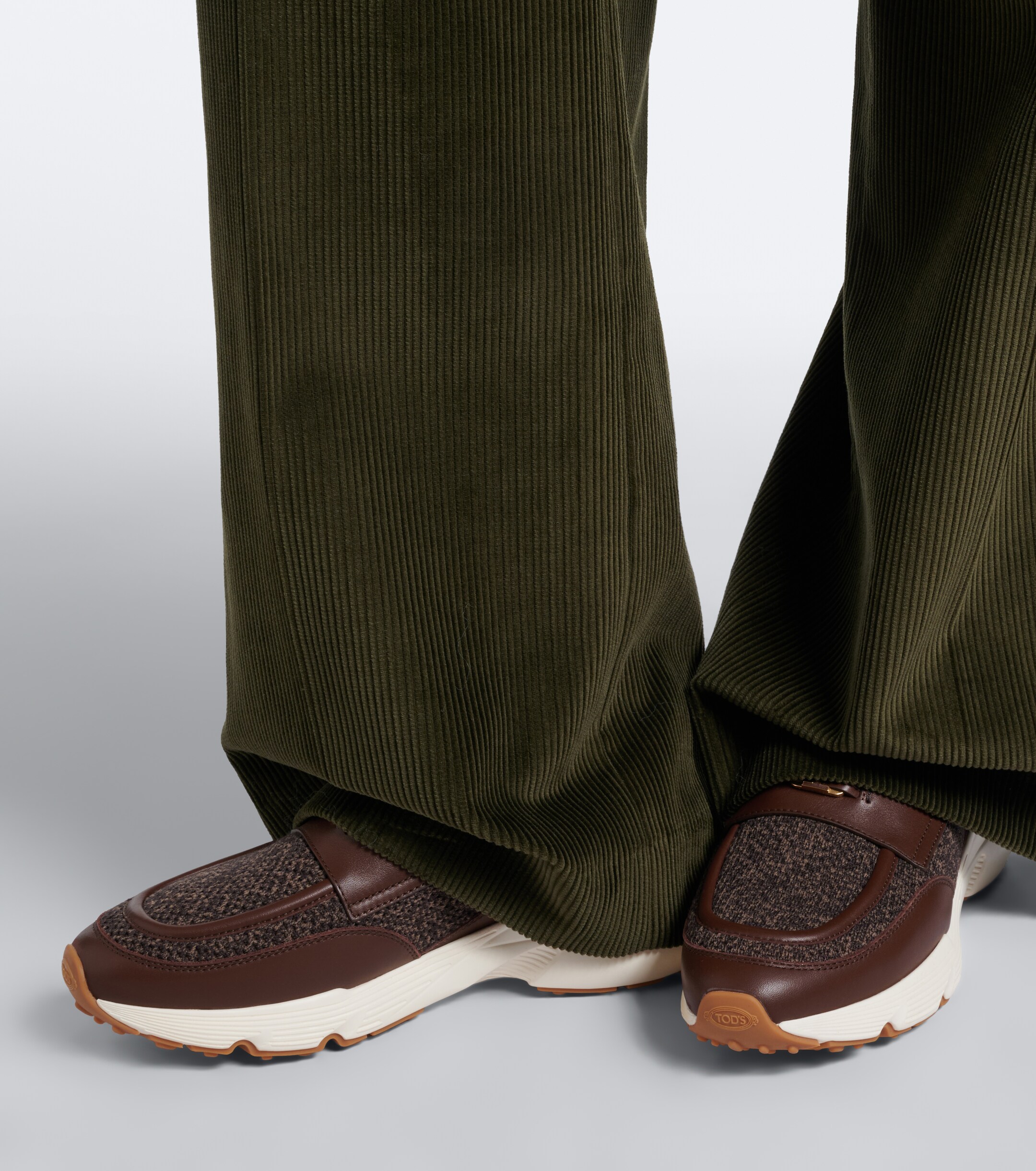Tod's Tod's Leather-trimmed knitted slip-on shoes