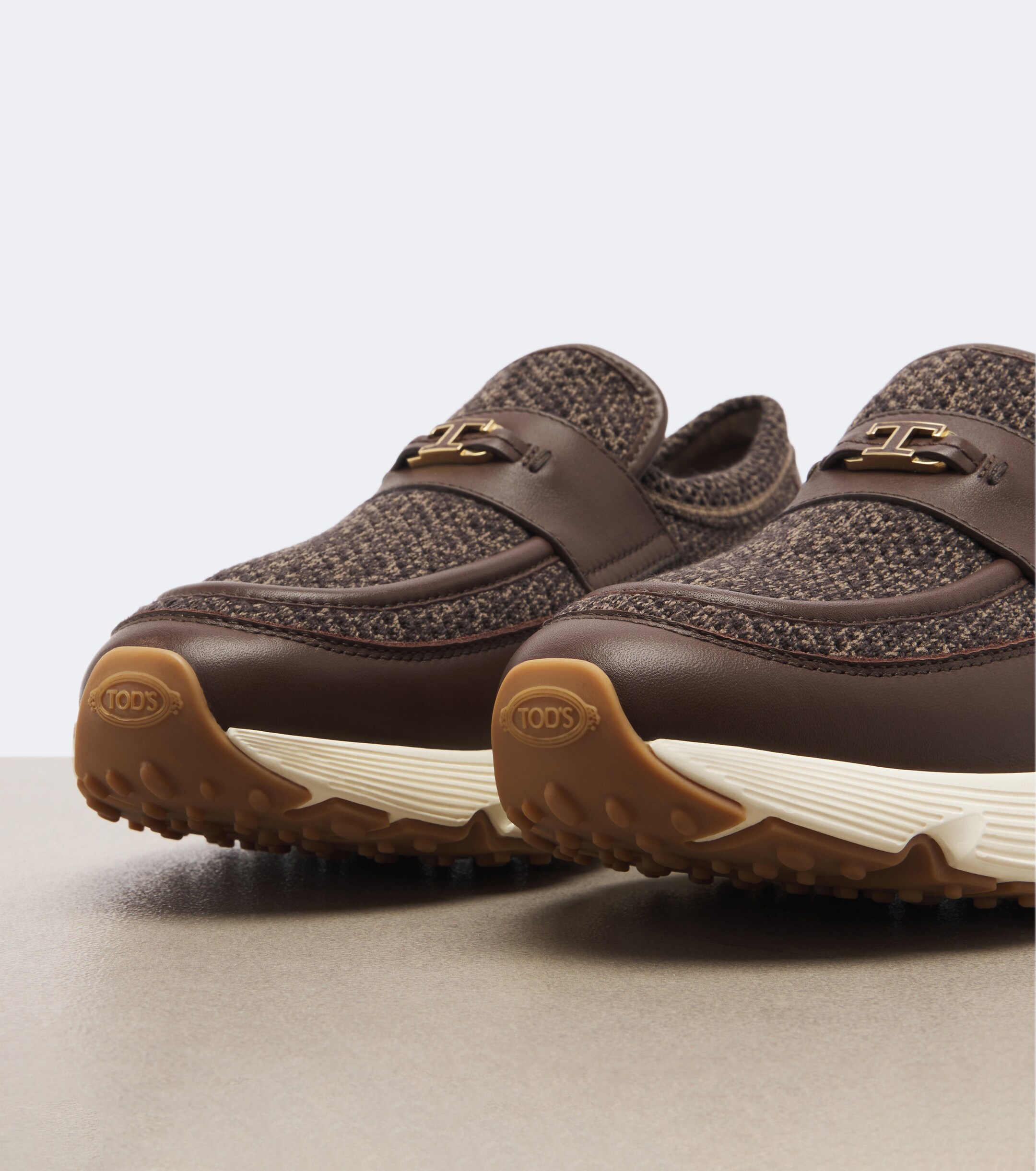 Tod's Tod's Leather-trimmed knitted slip-on shoes