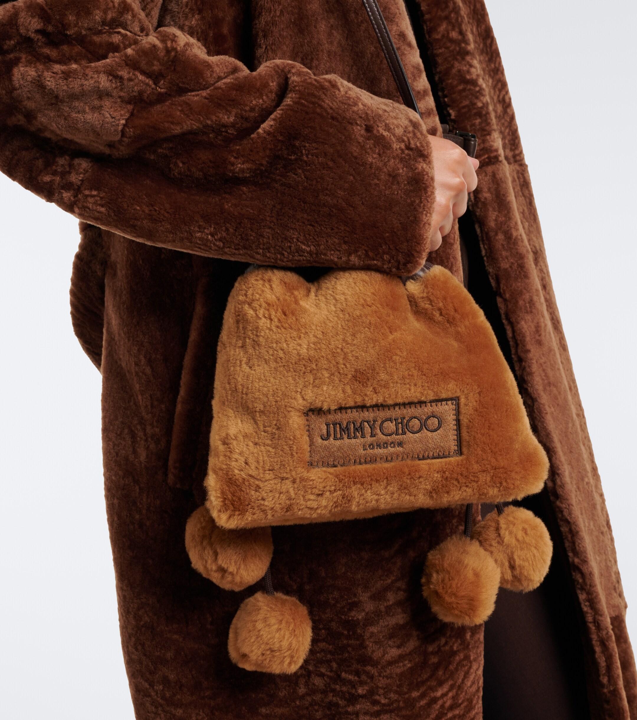 JIMMY CHOO Jimmy Choo Drawstring Mini shearling top-handle bag
