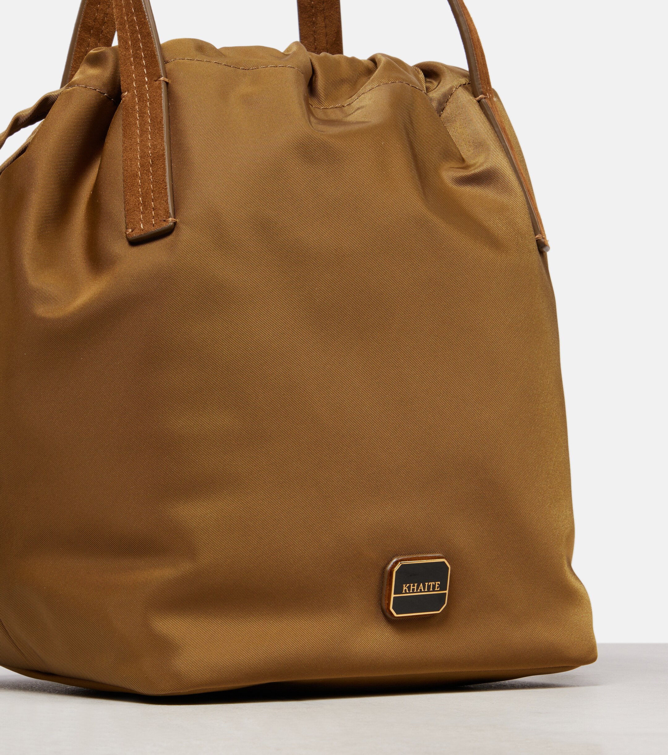 KHAITE Rory Medium leather-trimmed bucket bag