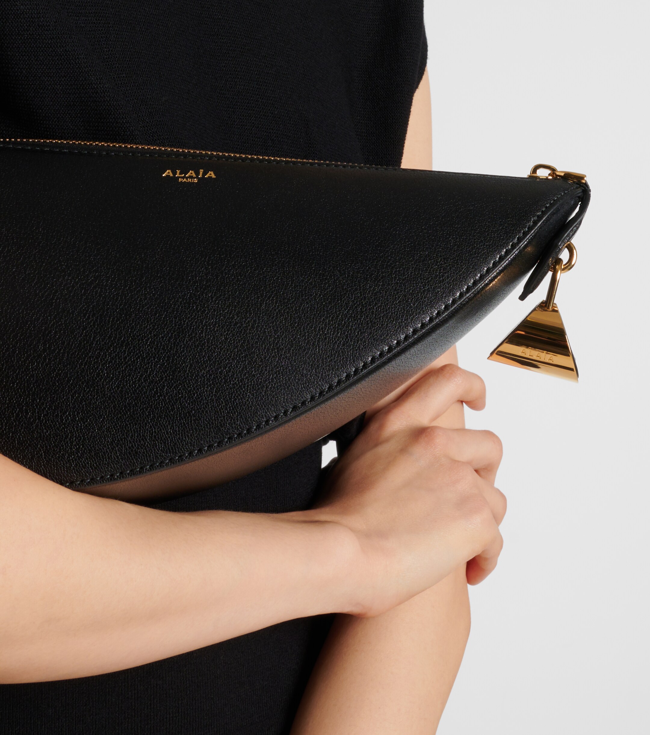Alaïa Le Demi Cœur leather clutch