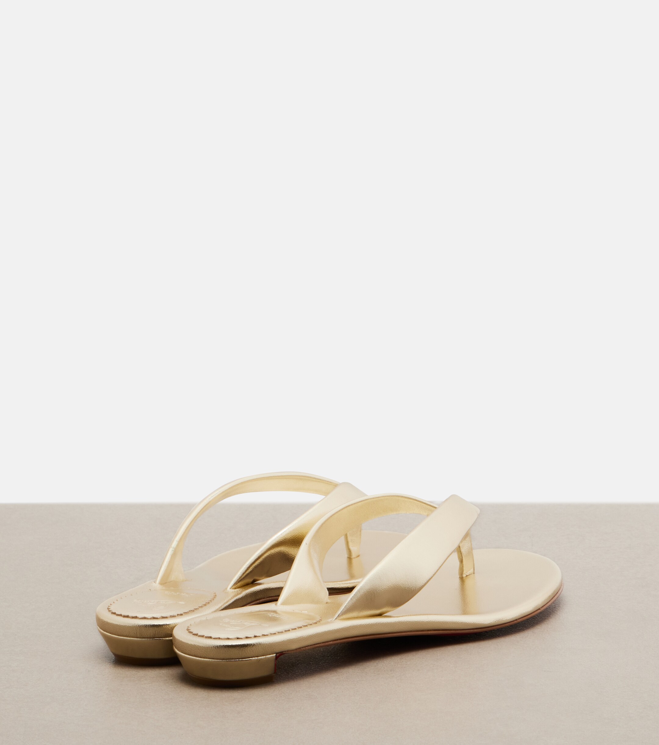 CHRISTIAN LOUBOUTIN Christian Louboutin Miss Z metallic leather thong sandals