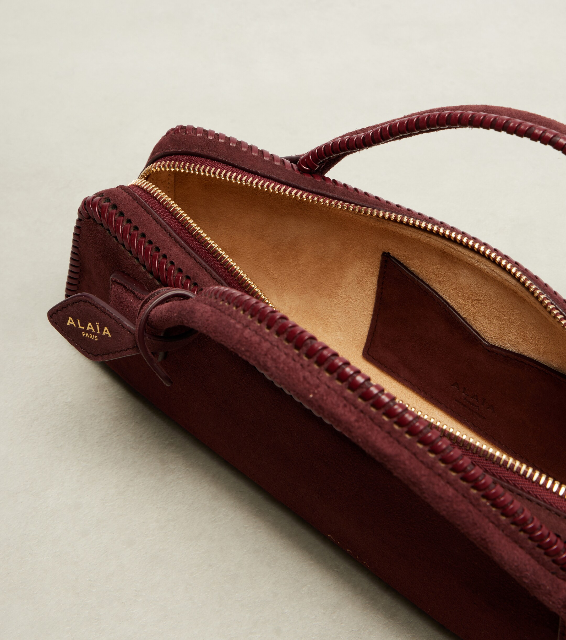 Alaïa Le Teckel Small suede clutch