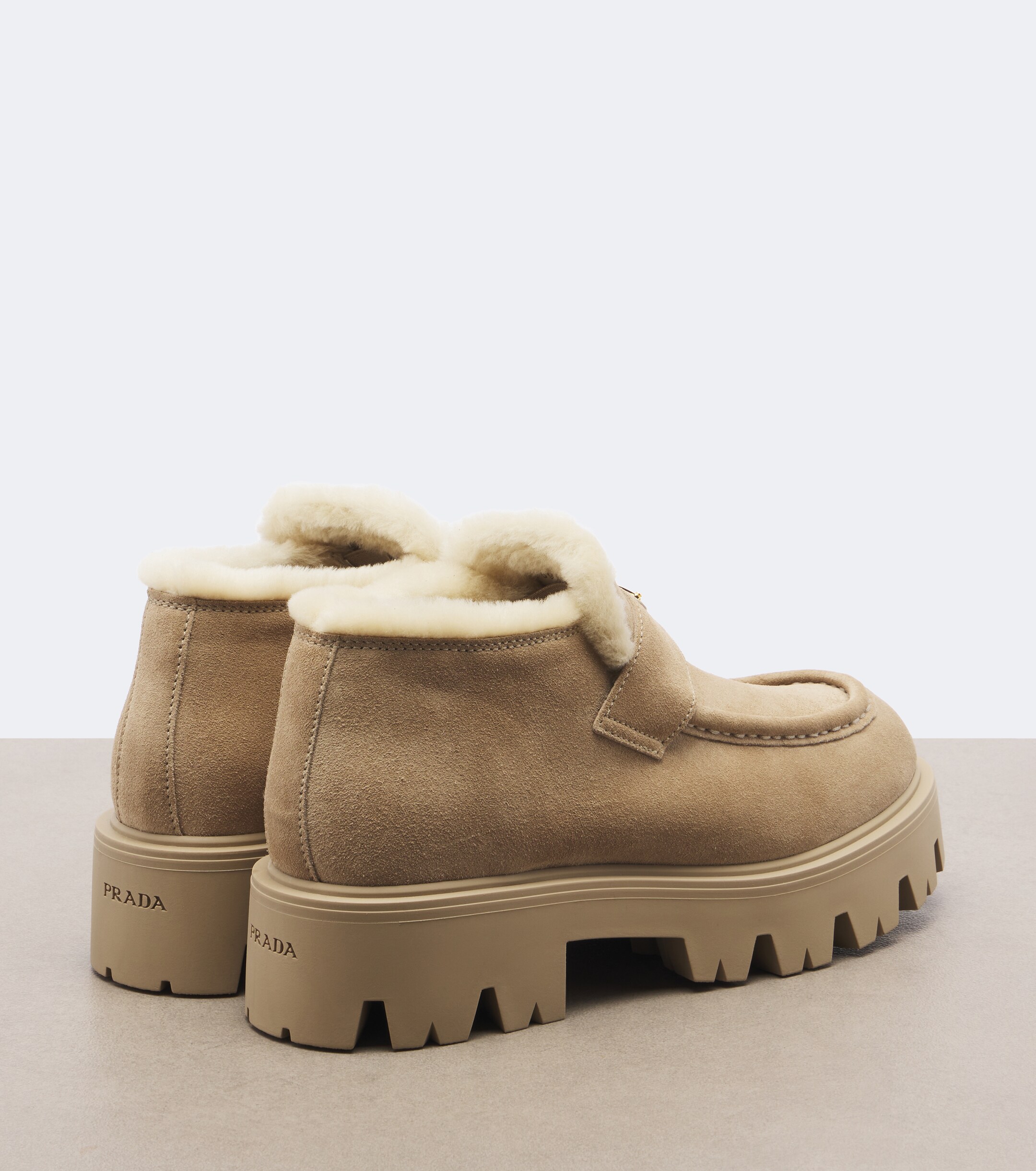 Prada Prada Shearling-trimmed suede platform ankle boots