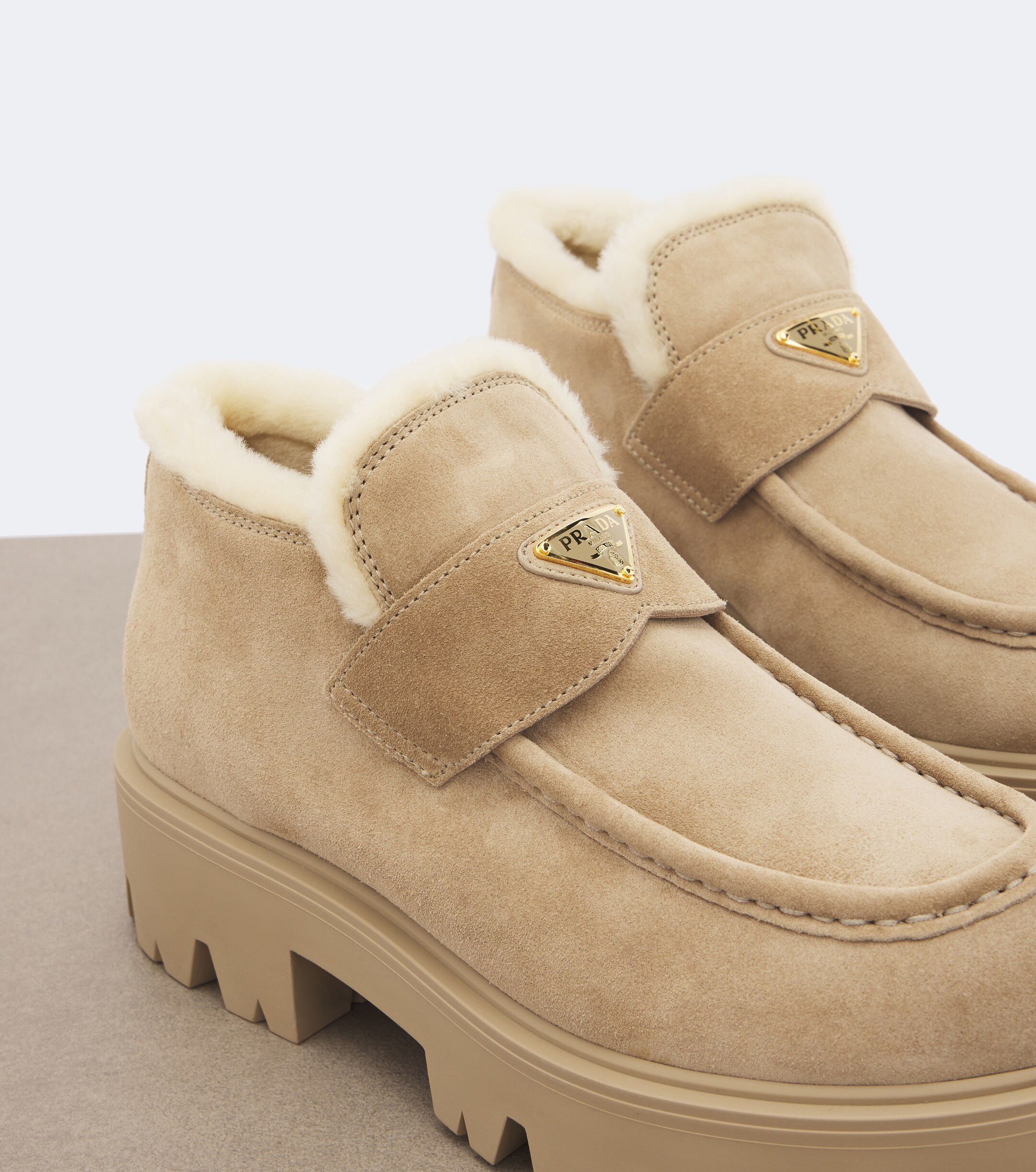 Prada Prada Shearling-trimmed suede platform ankle boots
