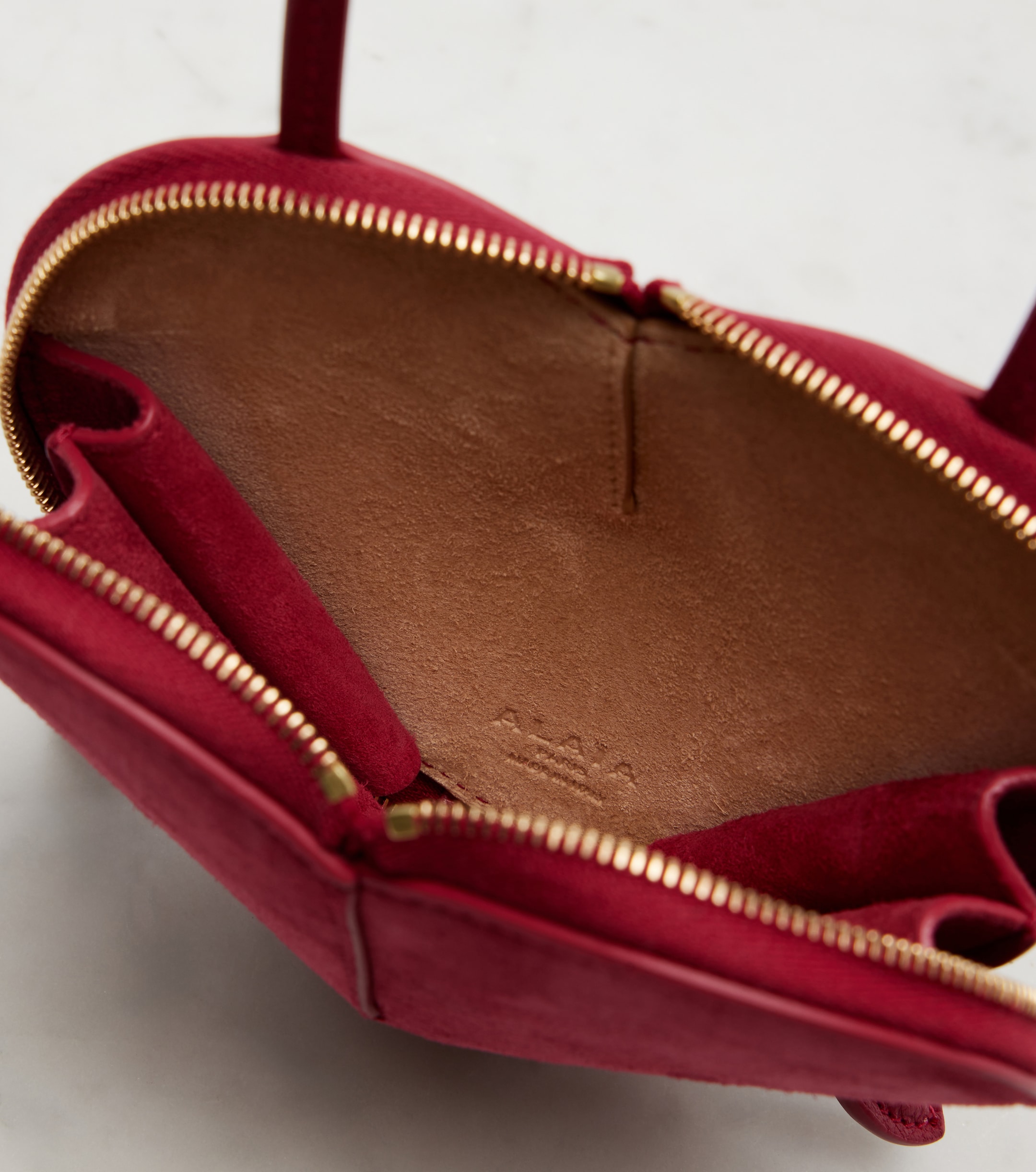 Alaïa Le Cœur leather and suede crossbody bag
