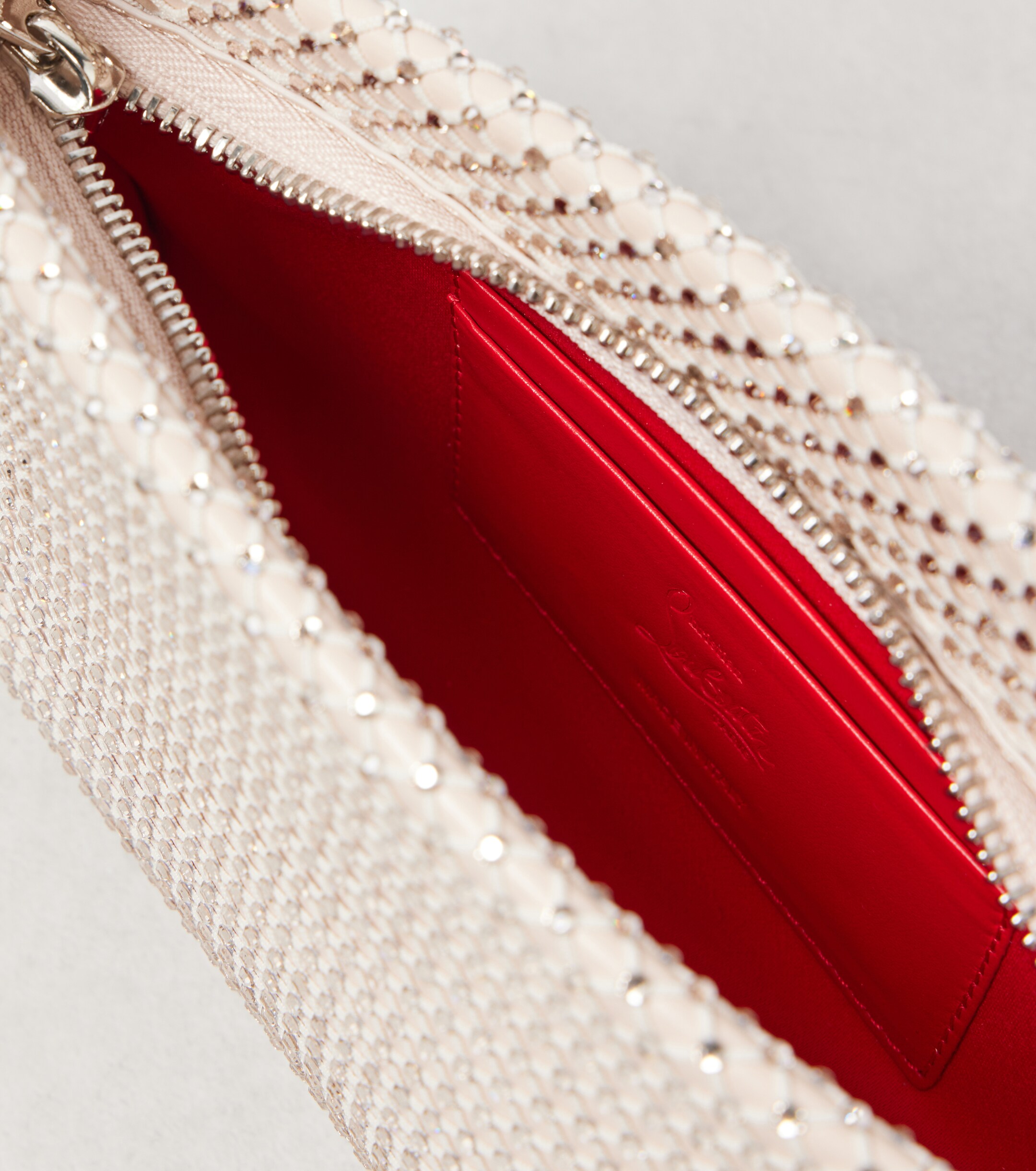 CHRISTIAN LOUBOUTIN Loubitwist Small leather clutch with strap
