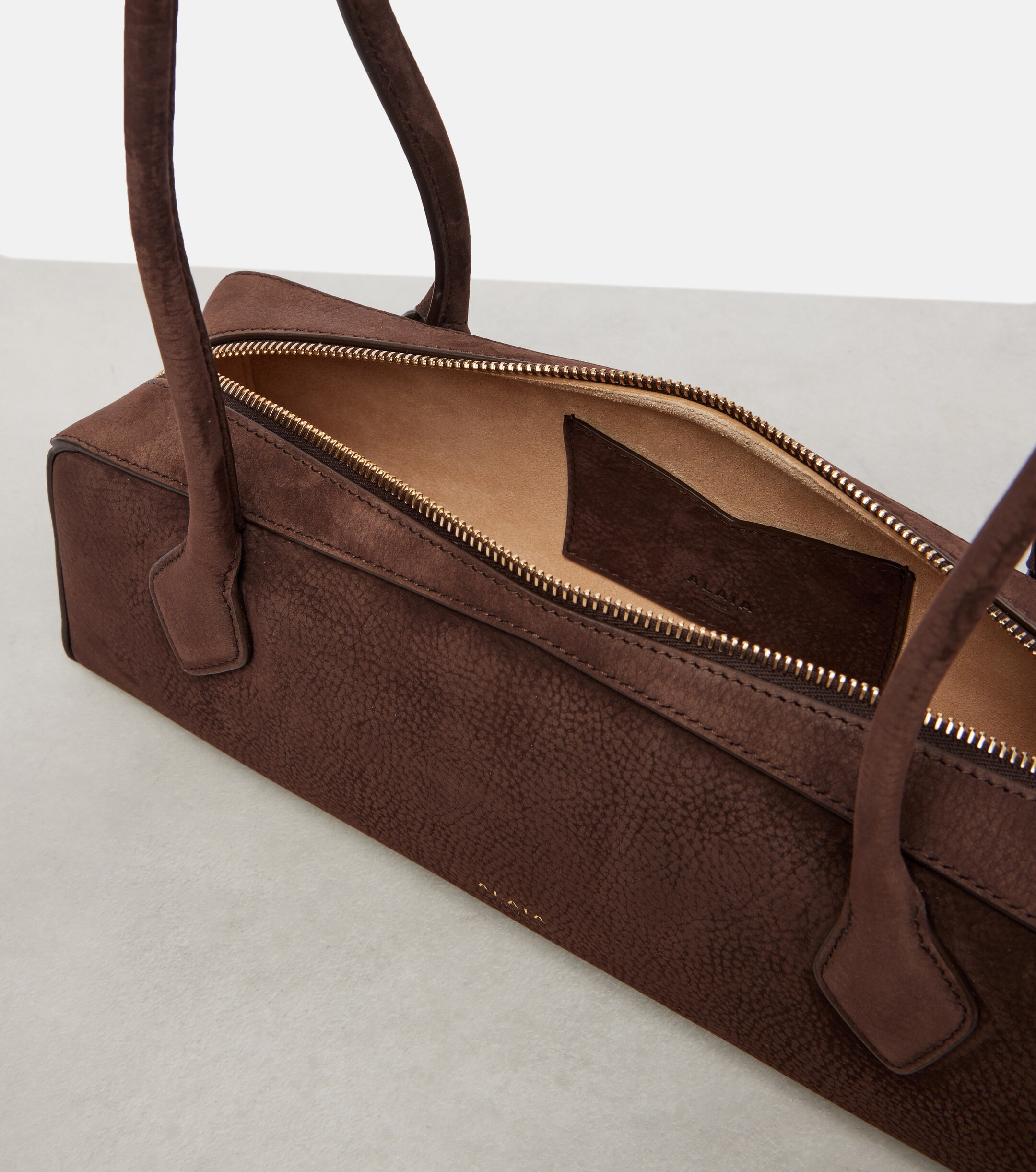 Alaïa Le Teckel Medium suede shoulder bag