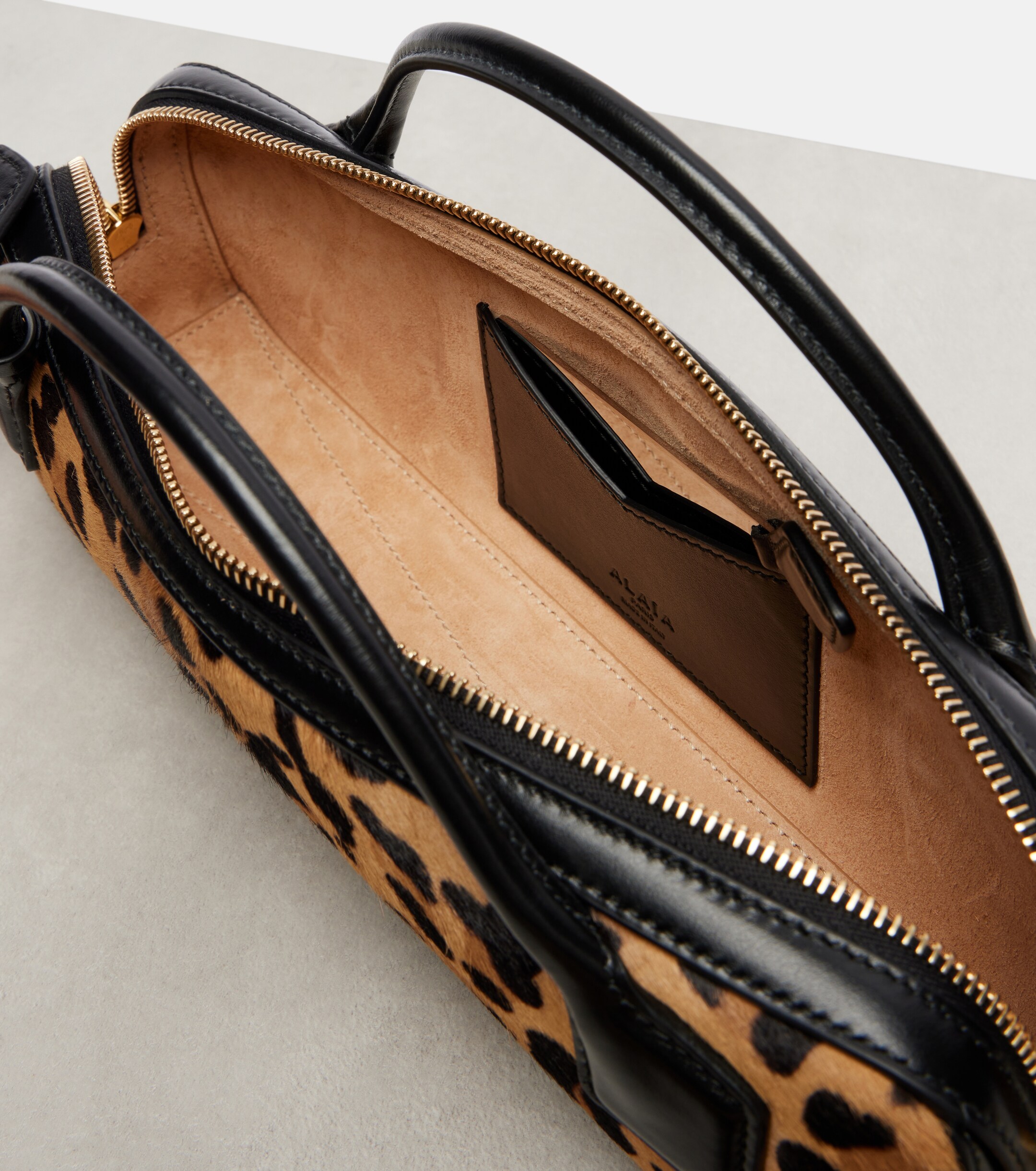 Alaïa Le Teckel leopard-print calf hair clutch