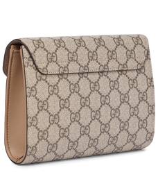 gucci supreme clutch