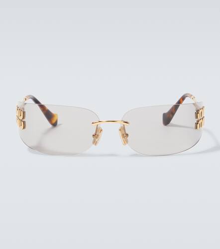Miu Miu Logo oval sunglasses - Miu Miu - Modalova
