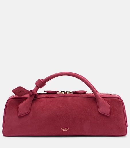 Le Teckel Small suede clutch in pink - Alaia | Mytheresa