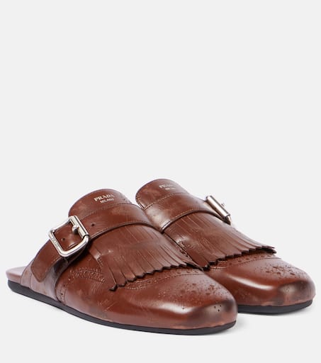 サンダル Shuffle antiqued leather mules with buckled strap and fringe Cognac Shuffle antiqued leather mules with buckled strap and