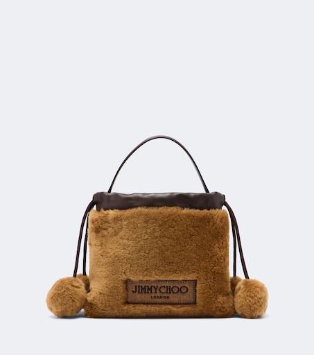 Drawstring Mini shearling top-handle bag in brown - Jimmy Choo