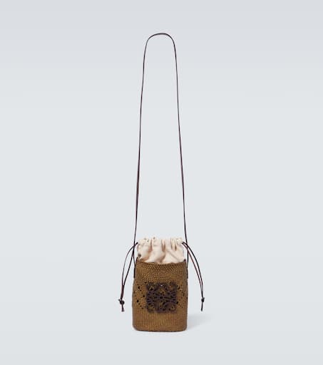 Paula's Ibiza Ajouré Anagram raffia bucket bag in green