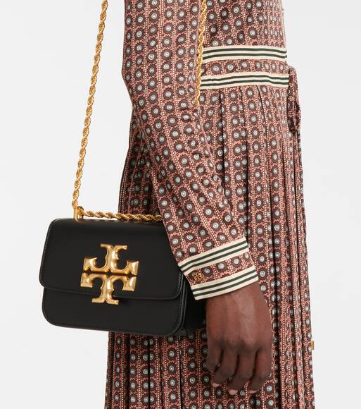 Tory burch cow print purse deals